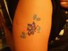glitter small flower arm tattoo